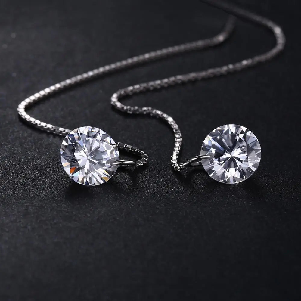Elegant 925 sterling silver hanging threads earrings with white cubic zirconia stones.