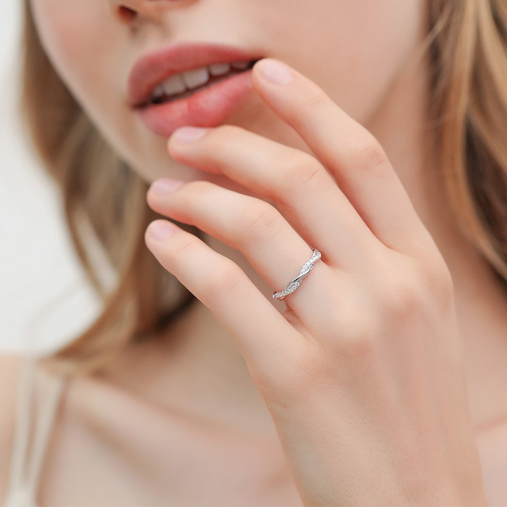 Silver moissanite band ring with a unique infinity cascade for a timeless look.