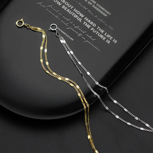 Two Dual Strand Silver Bracelets laid side by side showing white gold and yellow gold plating options