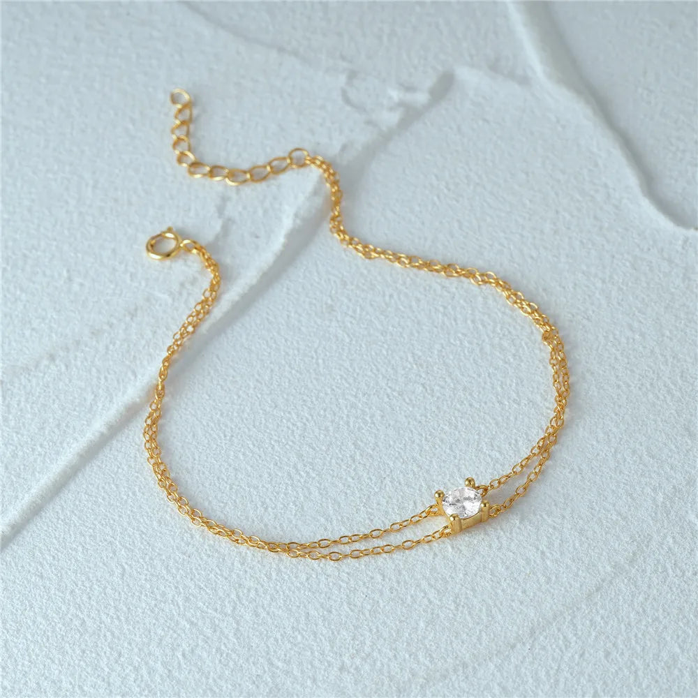 Stylish and lightweight gold double chain bracelet for everyday wear.