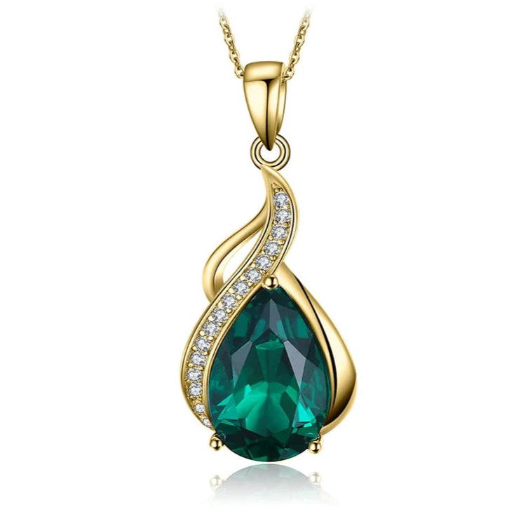 The Emerald Dewdrop Gold-Plated Pendant, featuring a teardrop-shaped simulated emerald in a luxurious gold setting.