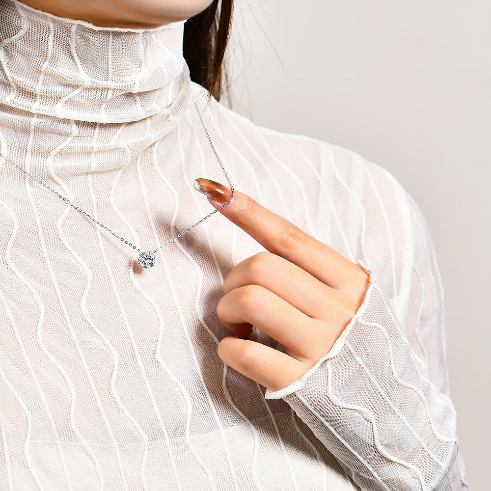 Model elegantly wearing the Ethereal Light Moissanite Silver Necklace, highlighting its timeless brilliance.