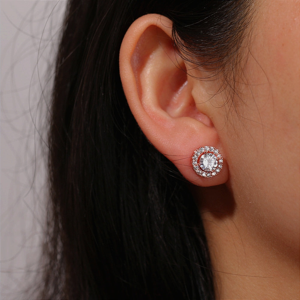 Close-up of model wearing Frosty Glow Silver Earrings, highlighting their elegant shine.