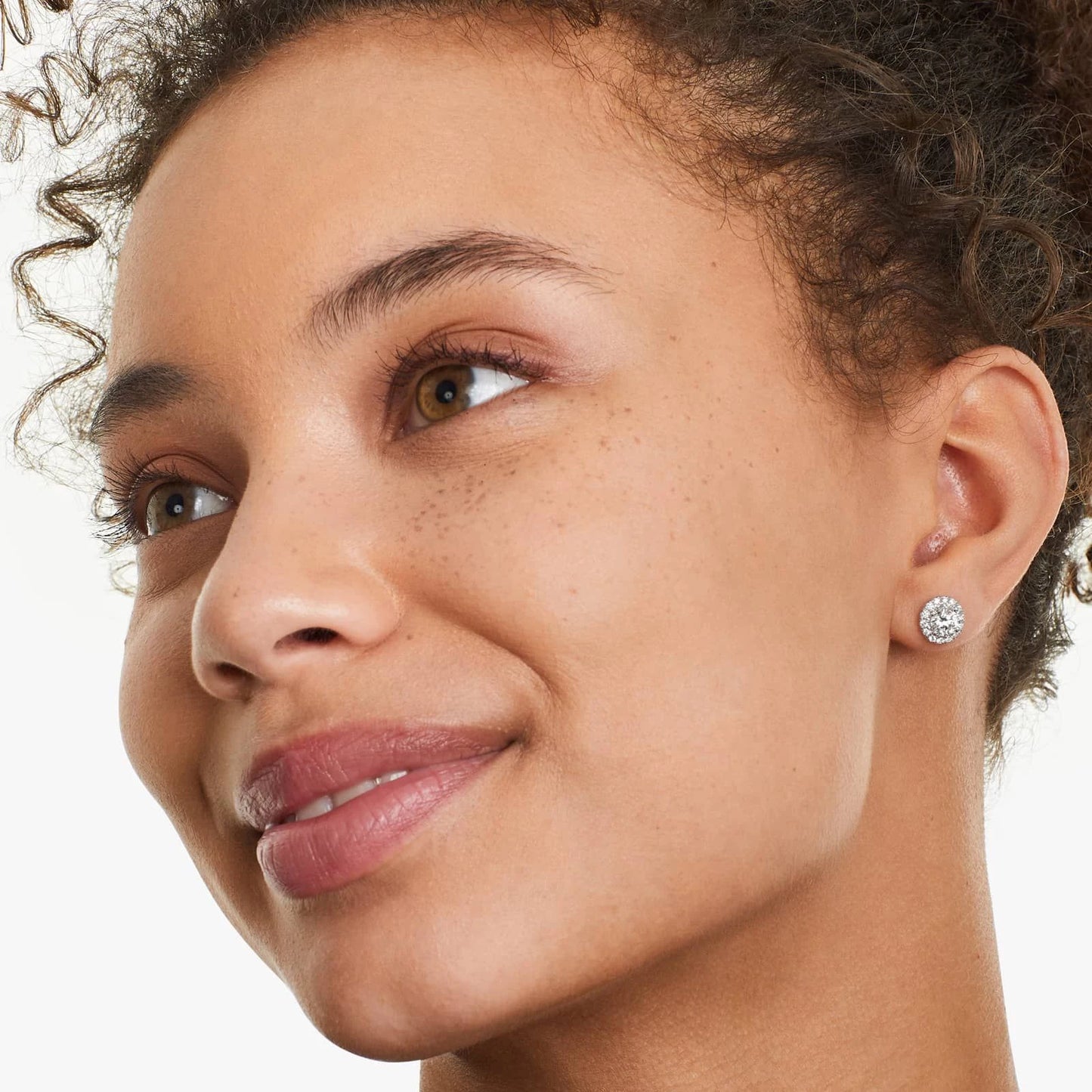Model wearing Frosty Glow Silver Earrings, showcasing their radiant cubic zirconia sparkle.