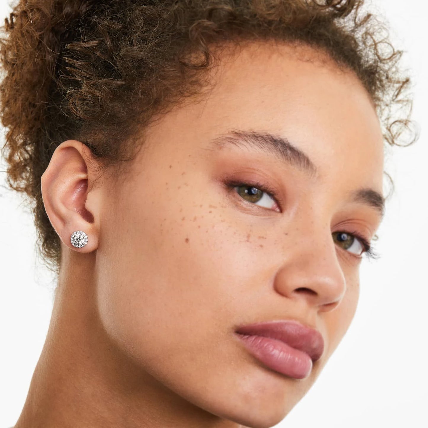 Side view of model wearing Frosty Glow Silver Earrings, capturing the brilliance of cubic zirconia.