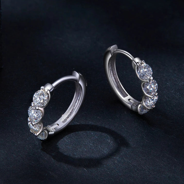 Close-up view of Luminous Glow Huggie Hoops showcasing their elegant pavé setting.