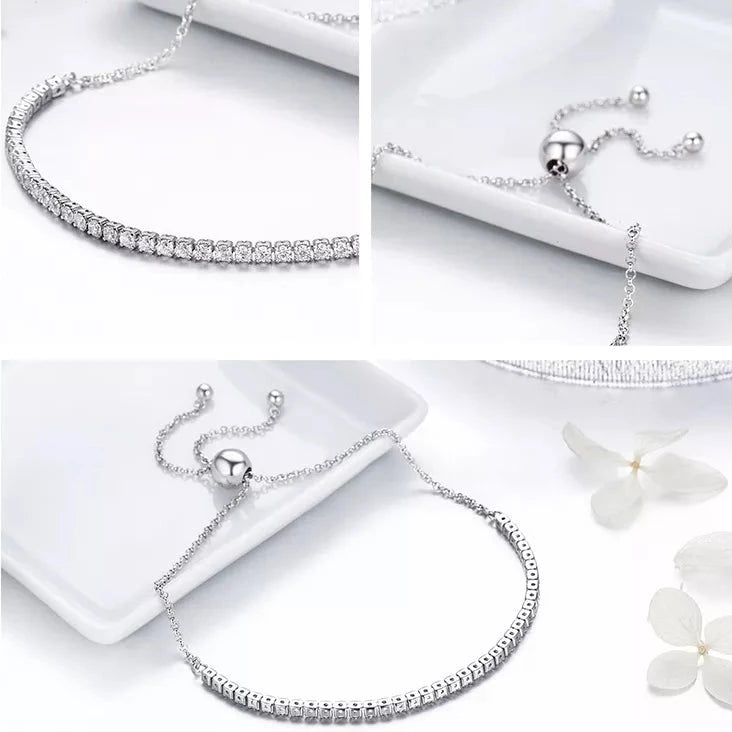 Close-up of an adjustable silver tennis bracelet with cubic zirconia for added elegance.