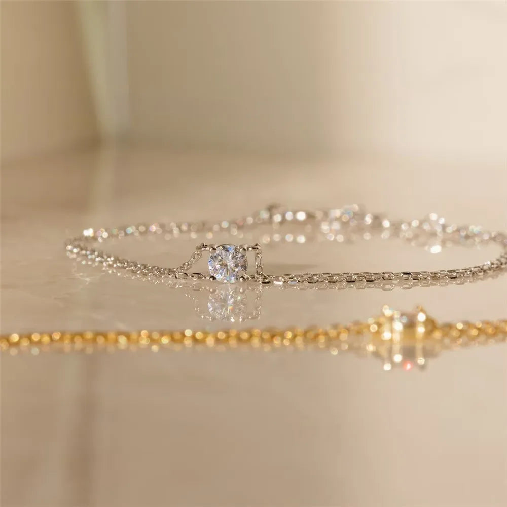 Close-up of a delicate silver double chain bracelet with a subtle shine.