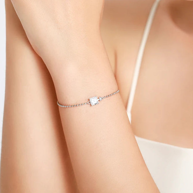 Model wearing the square stone silver bracelet with a square cubic zirconia stone, adding a touch of elegance.