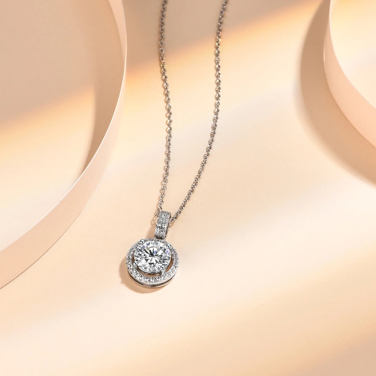 Elegant moissanite halo pendant necklace in 925 sterling silver, capturing the light beautifully.