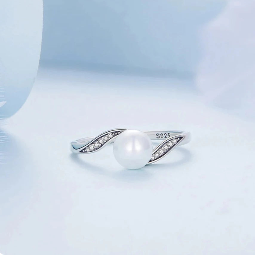 Front view of the Pearl Elegance Silver Ring with central pearl and cubic zirconia accents on oxidized silver band