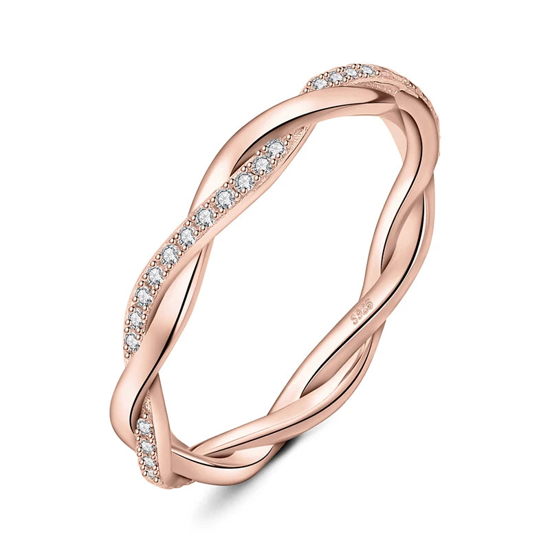 Close-up of a rose gold plated moissanite band ring with infinity cascade design.