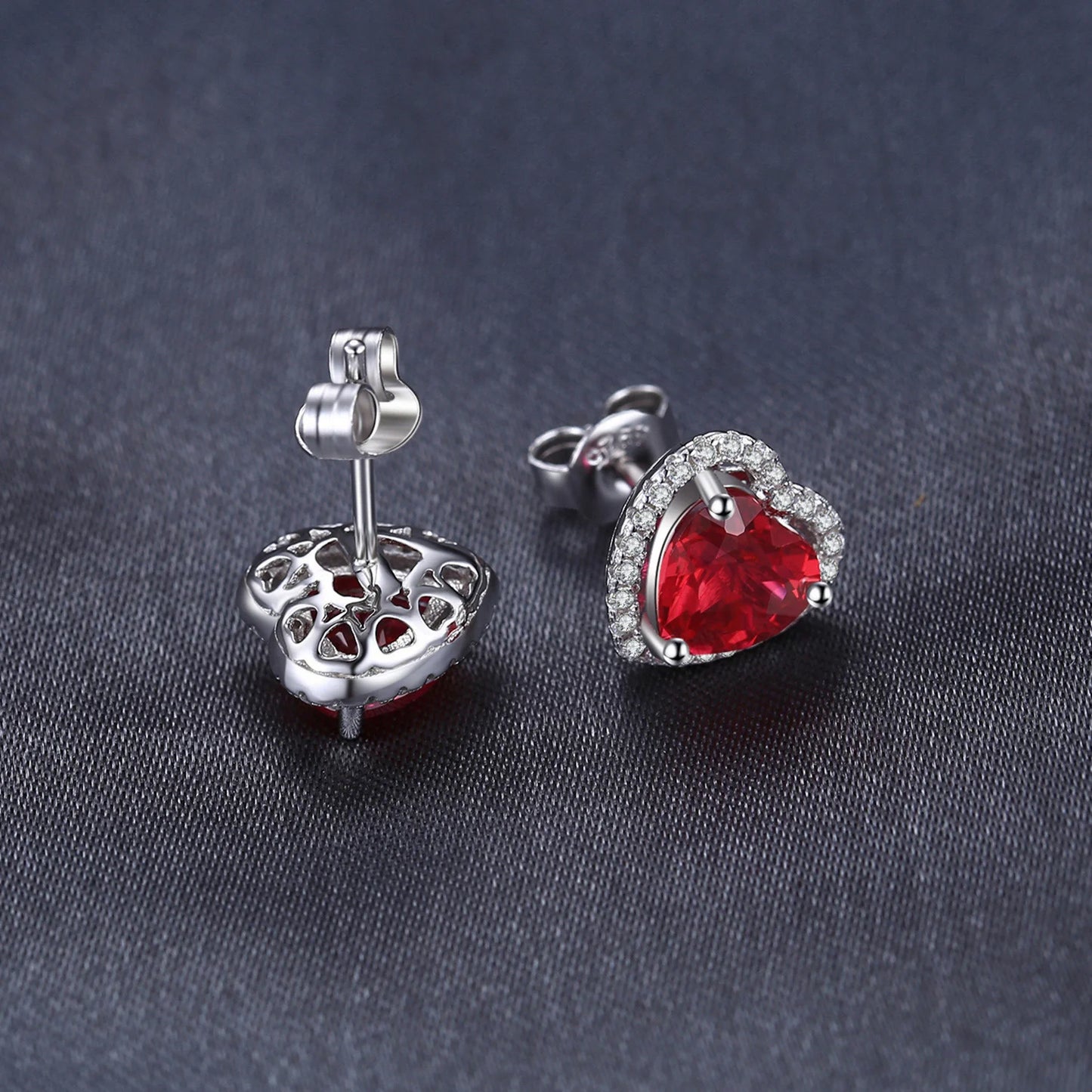 Close-up of the Ruby Love Silver Earrings revealing intricate details and vivid ruby sparkle.
