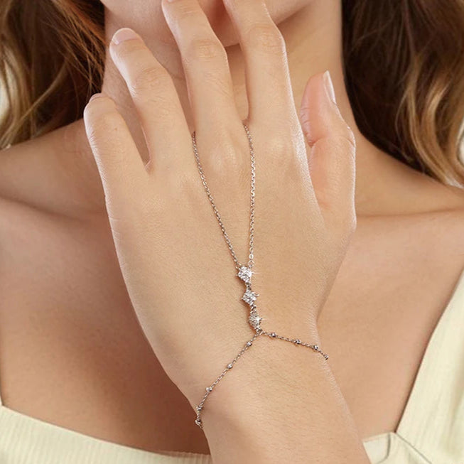 Women wear a delicate silver bracelet with small stones