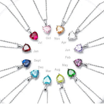 Silver birthstone heart necklaces set, featuring twelve different cubic zirconia stones representing each birth month.