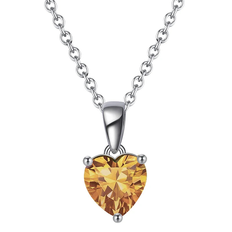 Charming silver heart necklace with Amber Sunset cubic zirconia, a warm orange gemstone pendant.