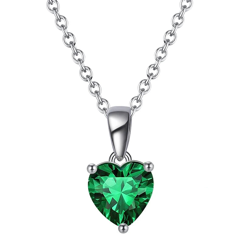 Silver heart necklace with Emerald Breeze cubic zirconia, a vibrant green gemstone pendant.