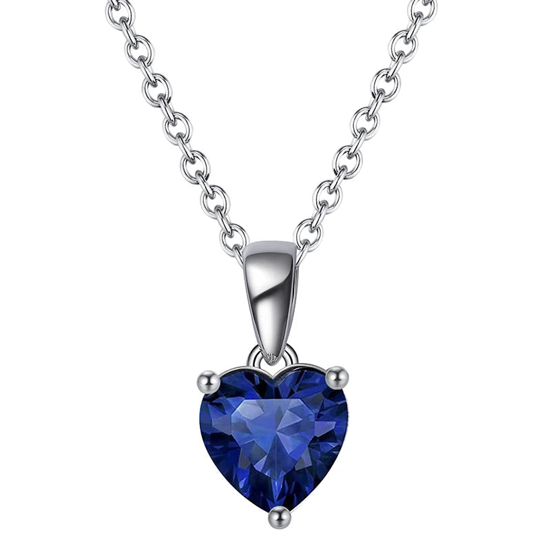 Elegant silver heart necklace with Midnight Ocean cubic zirconia, a striking dark blue birthstone.