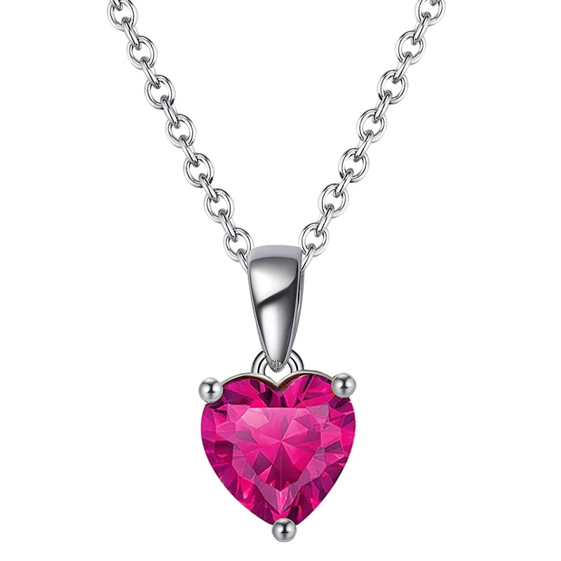 Elegant silver heart pendant necklace with Ruby Blossom cubic zirconia, a deep pink gemstone.