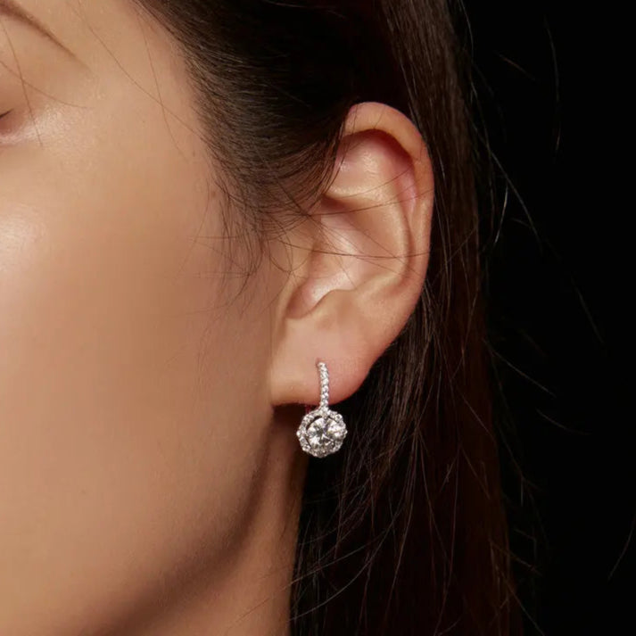 Radiant Halo Moissanite Earrings crafted from 925 sterling silver with shimmering stones.