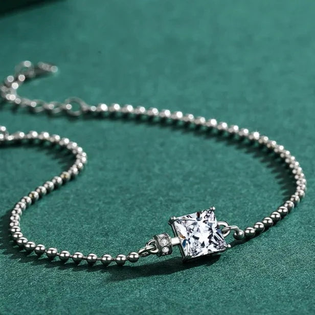 Detailed close-up of the silver bracelet with a square-cut cubic zirconia stone, designed for timeless elegance.