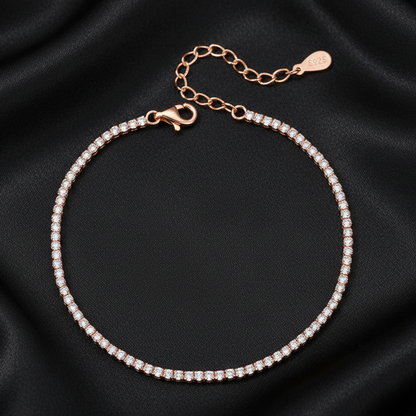 Luxury 18K rose gold plated tennis bracelet with high-clarity stones displayed on a premium black background