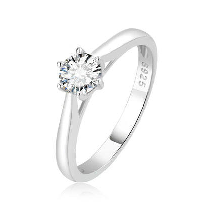 Silver ring with a small moissanite on a white background