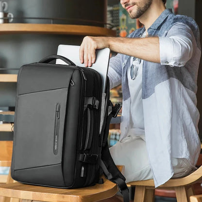 Black USB business backpack with expandable compartments and softback, offering comfort and efficiency for on-the-go professionals.