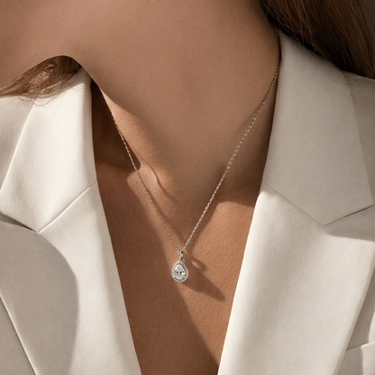 Model wearing the Celeste Pear Halo Necklace showing the 17.7" adjustable chain length and pendant scale