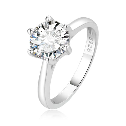 Silver ring with a large moissanite on a white background