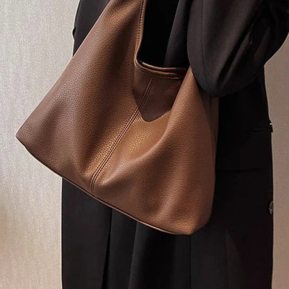 Modern leather bag with practical pockets and urban charm.