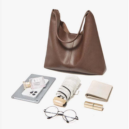 Stylish leather hobo bag with a modern urban aesthetic.