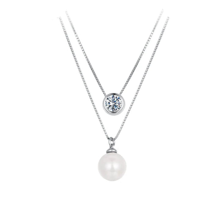 Sparkling moissanite and pearl pendants on the Elysian Spark Silver Necklace