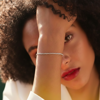 Model wearing the Glimmer Bolero Bracelet to demonstrate the adjustable fit