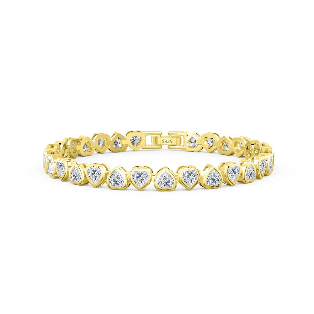 Gold-plated heart-cut tennis bracelet with sparkling cubic zirconia, perfect for any occasion.