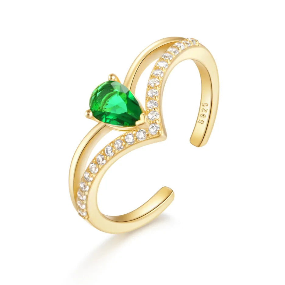A close-up of the Golden Ivy Adjustable Ring, featuring a pear-shaped green cubic zirconia set in gold-plated sterling silver.