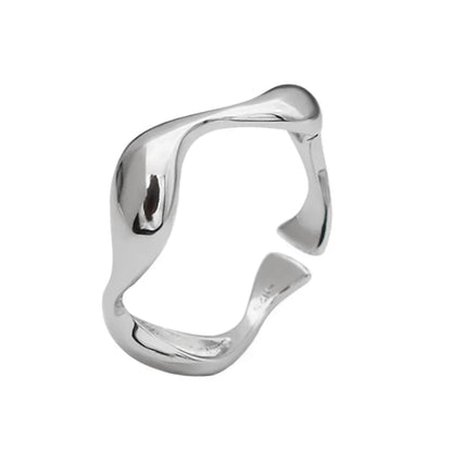 Close-up of the adjustable silver Golden Wave Stackable Ring, featuring a sleek wave design
