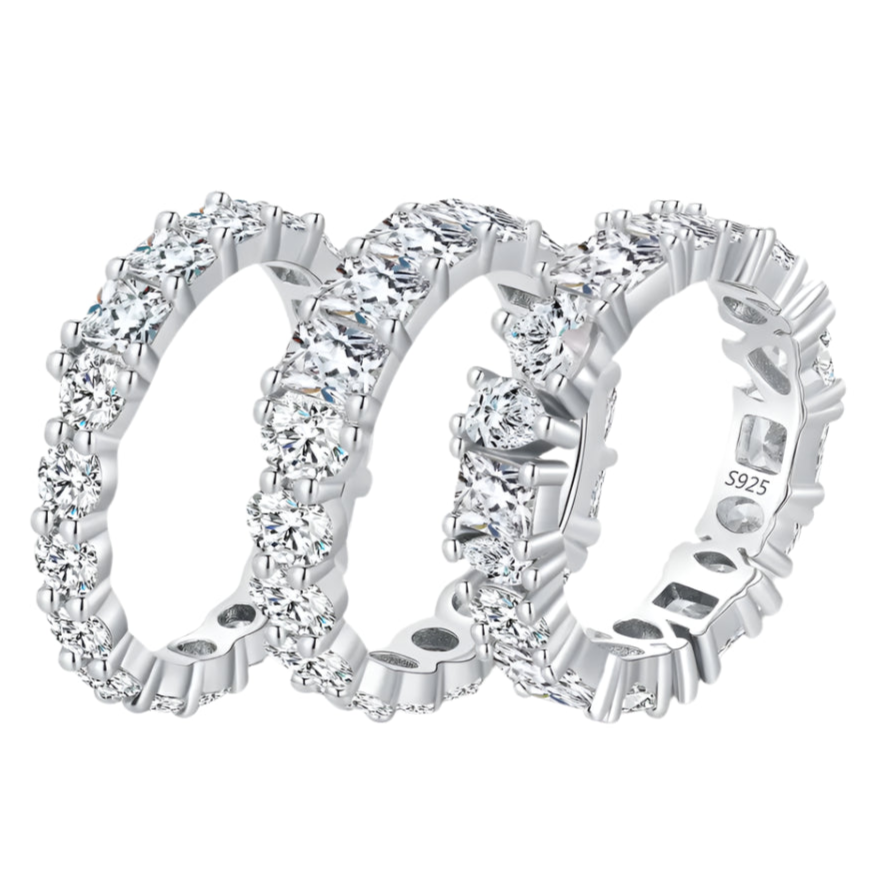 Trio of stackable Luna silver rings arranged side by side for design comparison.