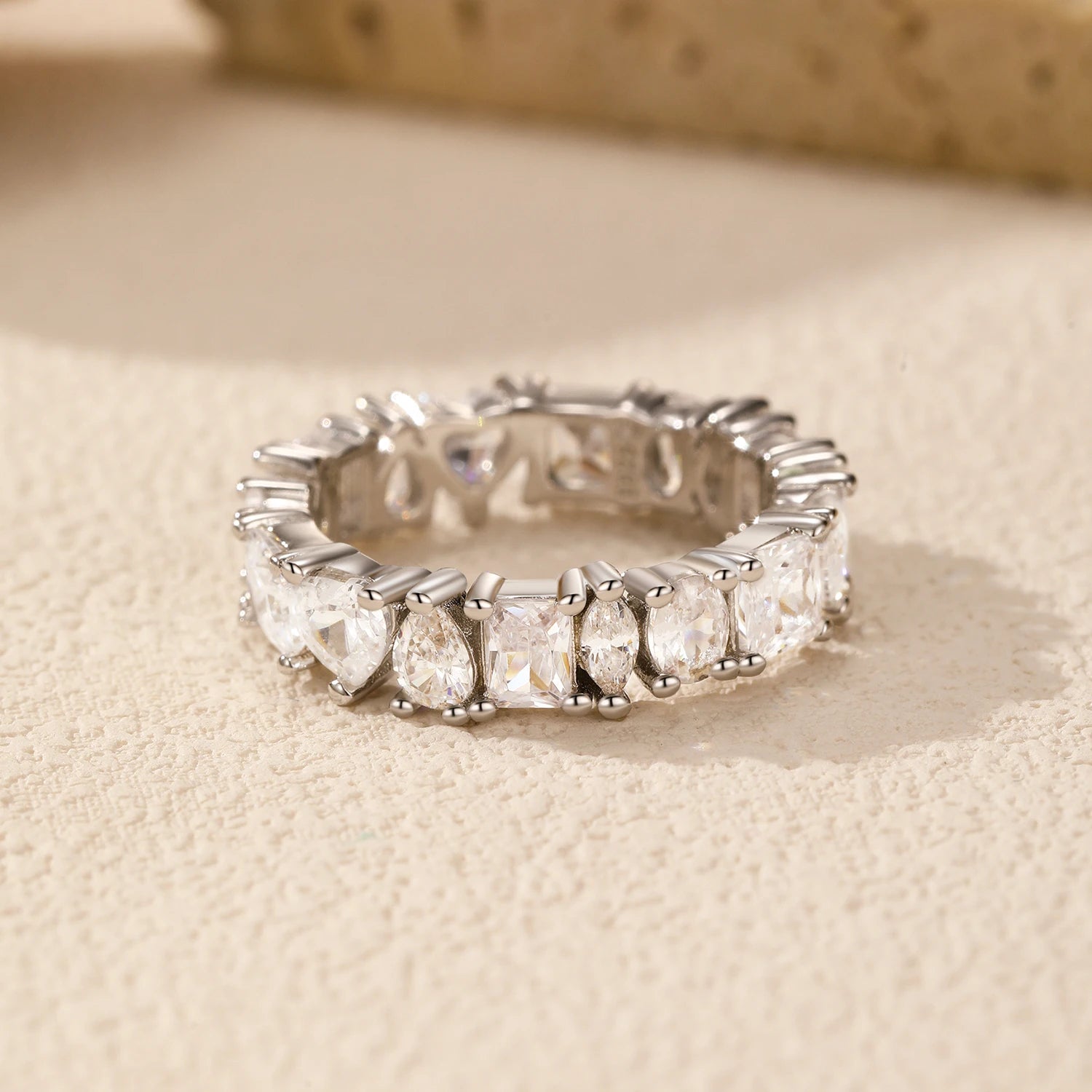 Detailed image highlighting the teardrop and square cubic zirconia stones in the Luna set.