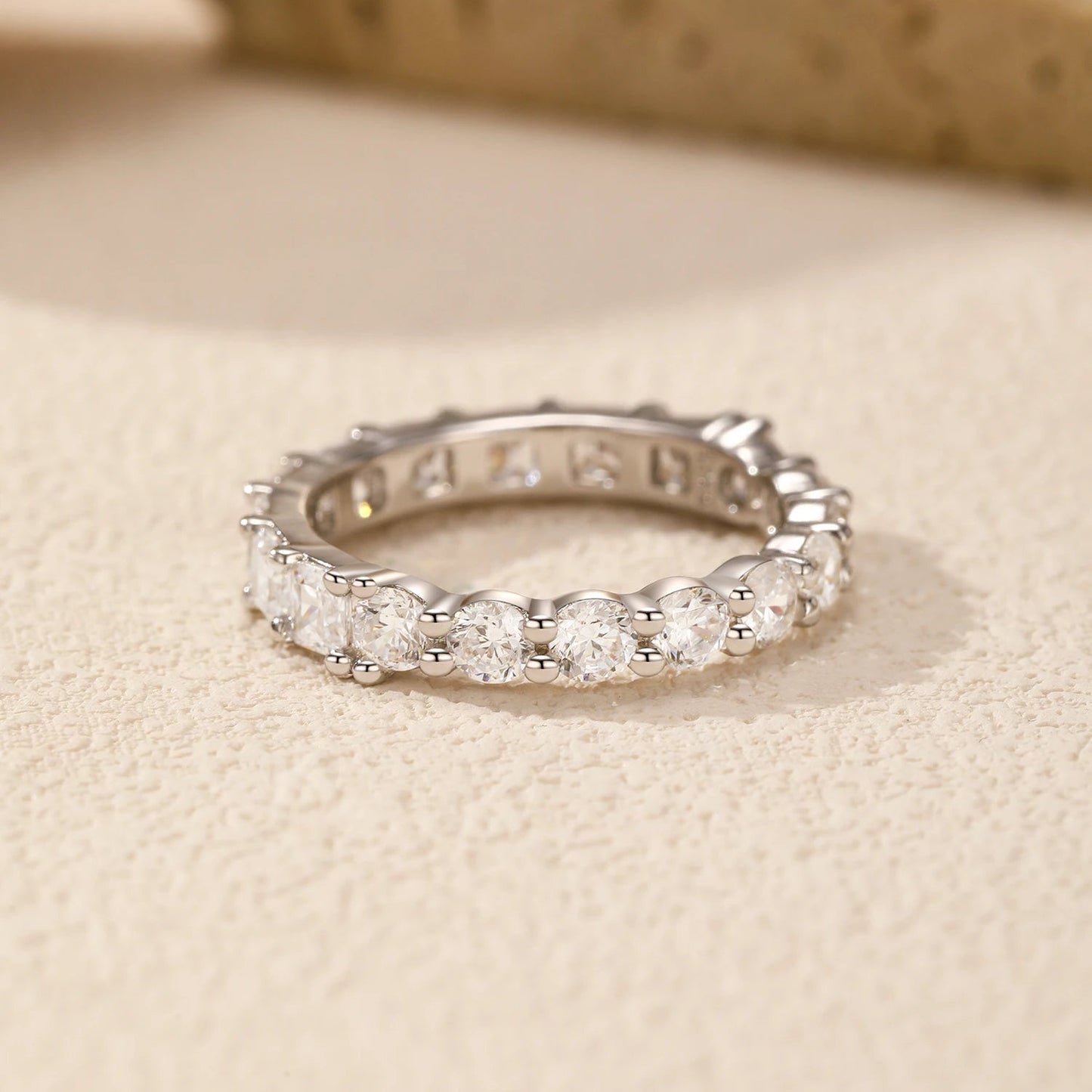 Luna Stacking Band Set shown in soft ambient light, highlighting the shine of its cubic zirconia stone.