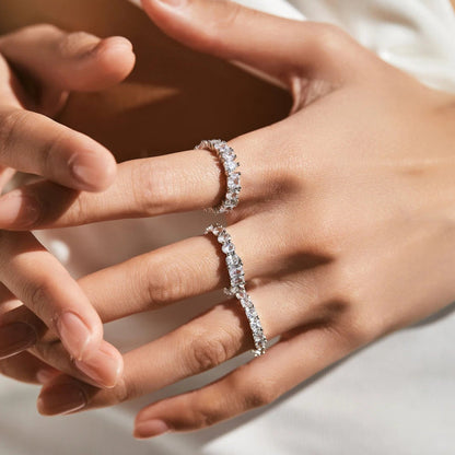 Luna Stacking Band Set worn stacked on one finger, showcasing elegant sparkle from all three rings.