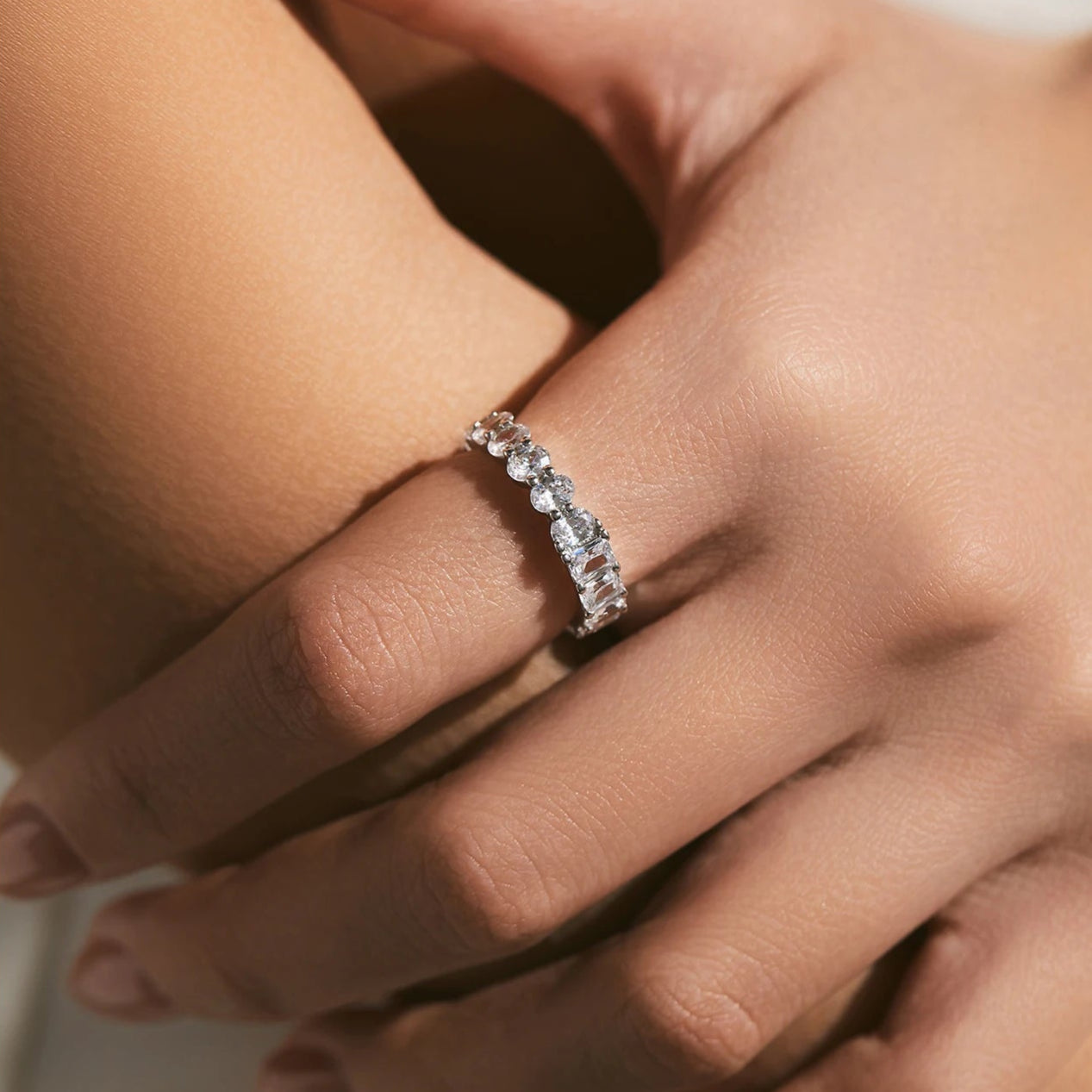Single Luna band worn solo, showing how each ring stands out with its own charm.