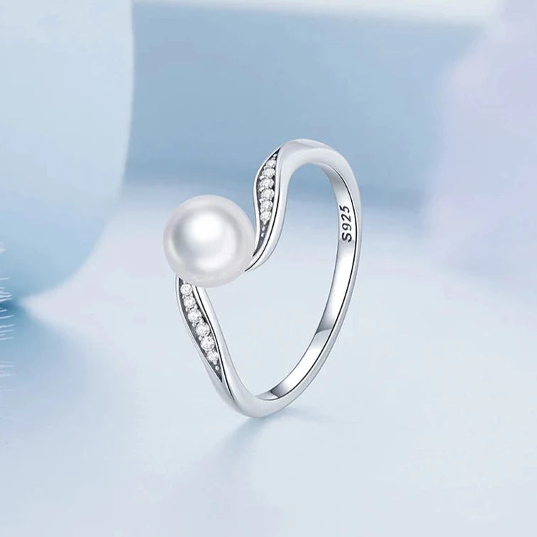 Side profile of the Pearl Elegance Silver Ring showing wave shape and sparkling cubic zirconia stones