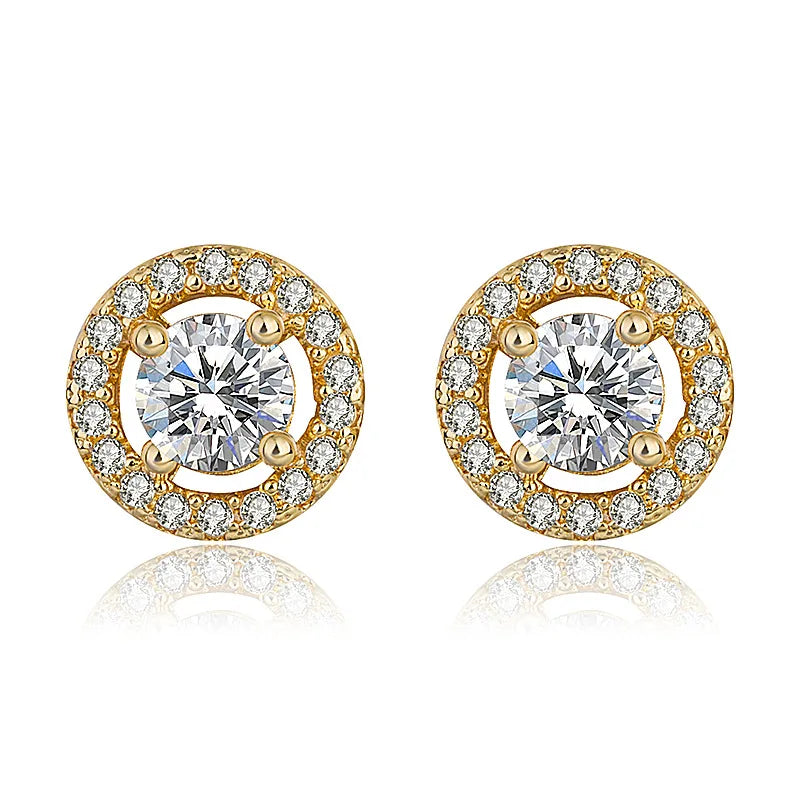 The Pure Halo Studs in an 18K gold-plated finish, showcasing the warm, radiant embrace design
