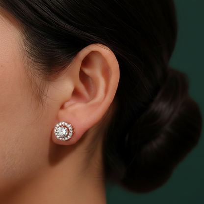 Profile shot of a model wearing the halo earrings, illustrating the architectural four-prong setting