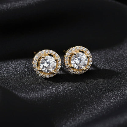 Close-up of the 18K gold-plated Pure Halo Studs against a dark silk background, showcasing the radiant embrace