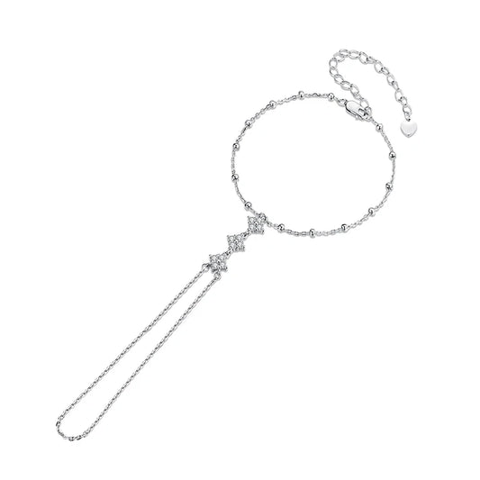 Silver bracelet with a ring chain and decorative clasp on a white background