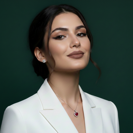 The Ruby Love Heart Pendant worn as a statement piece, showcasing the premium platinum finish over 925 sterling silver in natural lighting